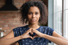 Head Shot Portrait Close Up Grateful African American Woman Showing Heart Sign Gesture, Looking At Camera, Expressing Love And Care, Female Volunteer Supporting, Regular Medical Checkup Promotion