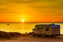 Camper Vehicle On Beach At Sunrise