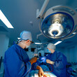 © Vadim - Medical team performing surgical operation in modern operating room