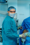 Fototapeta  - Portrait Shot of a Surgeon Thinking About Saving Life of a Patient.