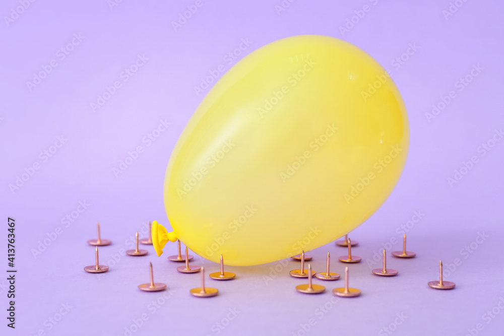 Office pins and air balloon on color background