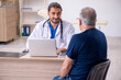 © Elnur - Old male patient visiting young male doctor