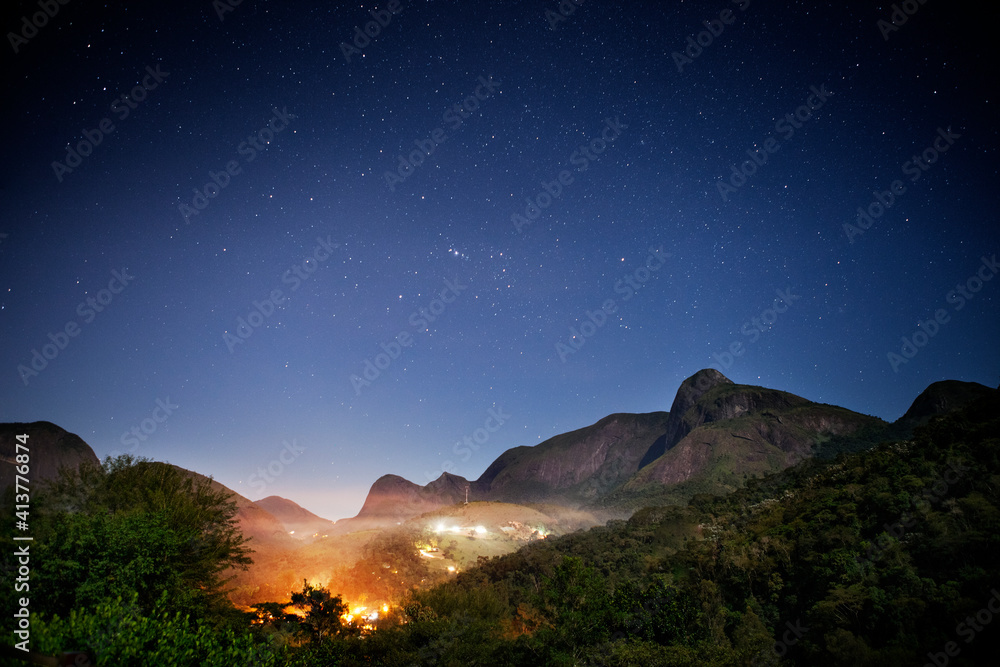 Idyllic view of mountains against blue sky during dusk
