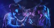 © DIgilife - Teenager having fun play VR virtual reality glasses sport game metaverse futuristic neon colorful background, future digital technology game gameFi NFT game and entertainment