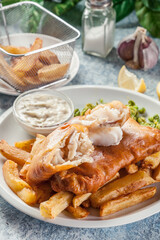 Wall Mural - Fish in beer batter and chips with green pea and tartar sauce