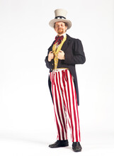 Portrait Of Man In Uncle Sam Costume Against White Background