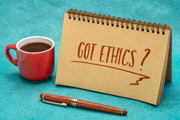 Wall Mural - Got ethics? Are you ethical question. Handwriting in a spiral notebook with a cup of coffee.