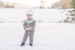 © Cavan Images - Boy kid child in snow winter wonderland wool outfit clothes