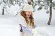 © Cavan Images - Little Red Haired Girl Playing in the Snow