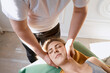 © Cavan Images - masseur works. man makes a beautiful woman massage