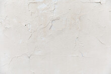 Texture Of A White Old Wall With Cracks And Peeled Paint