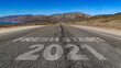 © WD Stock Photos - Fresh Start 2021 written on highway road to the mountain