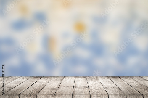 Obraz Dibond Empty wooden table with garden bokeh for a catering or food background with a country outdoor theme.