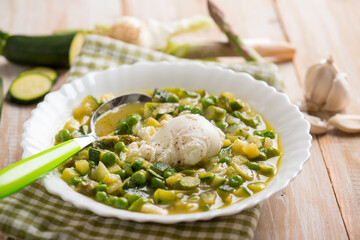 Sticker - soup with poche egg green peas asparagus and zucchinis