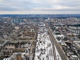 Fototapeta Paryż - Snowy residential area of Kiev. Aerial drone view. Winter snowy morning.