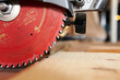 © Cavan Images - Circular saw on table in workshop