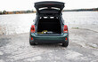 © Cavan Images - rear view of a Mini Countryman electric car with a lead in the trunk