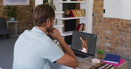 Canvas Print - Caucasian male student using laptop on video call with female teacher