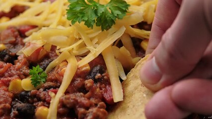 Poster - Taking Chilli con Carne with tortilla chips. Mexican food.