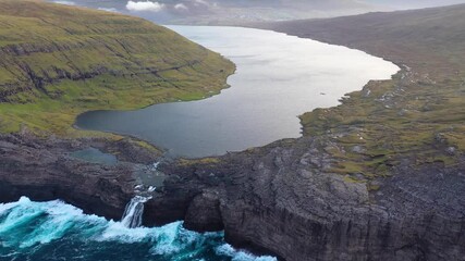 Wall Mural - Top Down cliffs and coast line with waves breaking