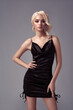 © lyashko - Blonde sexy young beauty woman in black dress
