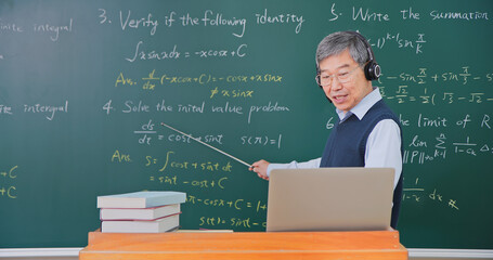 Wall Mural - Senior professor teaching online