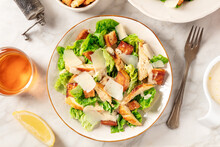 Caesar Salad Overhead Flat Lay Shot. Grilled Chicken Breast Slices, Green Romaine Salad Leaves, Croutons And Parmesan, The Classic Recipe