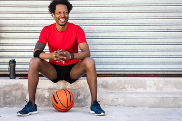 Afro athlete man relaxing after training.