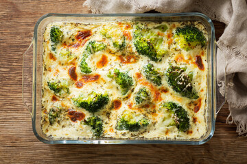 Wall Mural - Casserole broccoli. Baked broccoli with cheese and cream sauce, top view