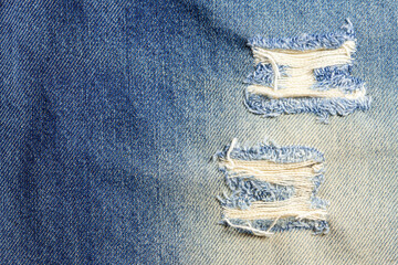 Wall Mural - Jeans torn denim texture background.