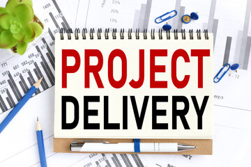 Project Delivery. Text on white notepad paper on light background