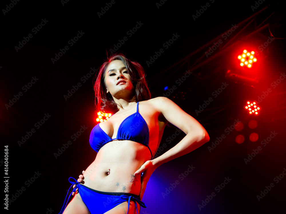 Asian sexy woman in bikini dancing show on stage. Stock Photo | Adobe Stock