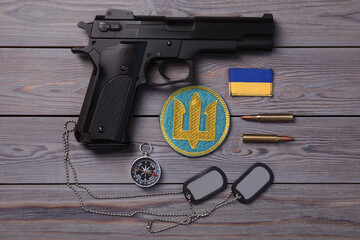 Wall Mural - MYKOLAIV, UKRAINE - SEPTEMBER 19, 2020: Flat lay composition with Ukraine military equipment on grey wooden table