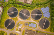 © AmazingAerialAgency - Aerial view of circular water tanks of a factory in Harelbeke, West Flanders, Belgium.