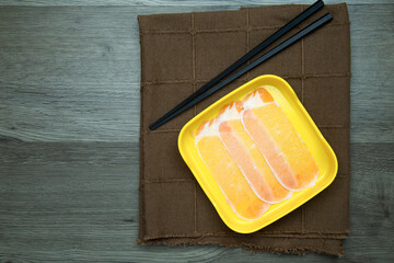 Wall Mural - fresh raw pork, meat ,beef, belly, sliced on square plate  on wood, wooden background,set shabu, hot pot ingredients.