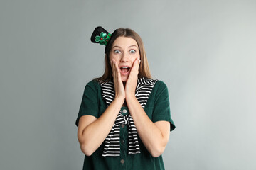 Sticker - Emotional woman in St Patrick's Day outfit on light grey background