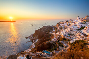 Wall Mural - Sunset view of traditional Greek village Oia on Santorini island in Greece