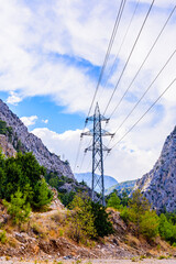 Wall Mural - High voltage power line in canyon not far from the city Kemer. Antalya province, Turkey