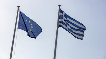 Sticker - Greece and EU. Greek and European Union flags waving on clear blue sky