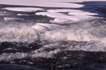 Mountain river in winter. Icebreaker of ice floes. Winter. Cold