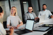 © Flamingo Images - Businesspeople meeting in an office