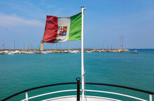 View From Stern Of Ship With Italian Flag On Pole.