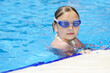 Little girl swimming at the pool