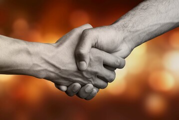 Business agreement handshake on blur background.