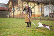 © Xalanx - Old farmer woman cleaning with a rake