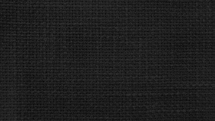 Wall Mural - dark black linen texture, burlap fabric as background. close up black weaving or mesh fabric texture background. 
