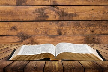 Wall Mural - open book on old wooden table.