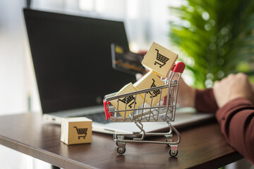 Selective focus of woman using a lab top for shopping online.