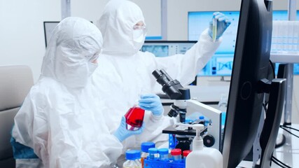 Wall Mural - professional team of scientists is working on a vaccine in a modern scientific research laboratory. 