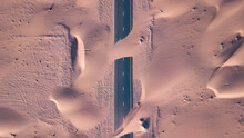 Aerial Top View Of Roads Through Sand Dunes In Dubai, UAE